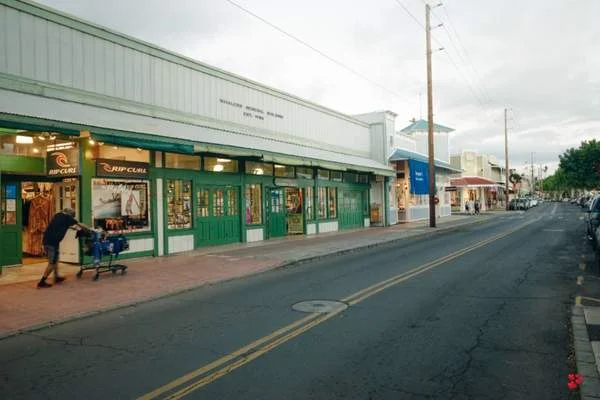 Discreet local shops are lined up in Leytonstone alongside larger chain shops like Tesco